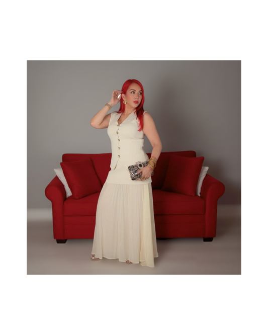 Red Eleganza Boutique cream skirt set with sleeveless vest top featuring gold buttons and a layered long skirt